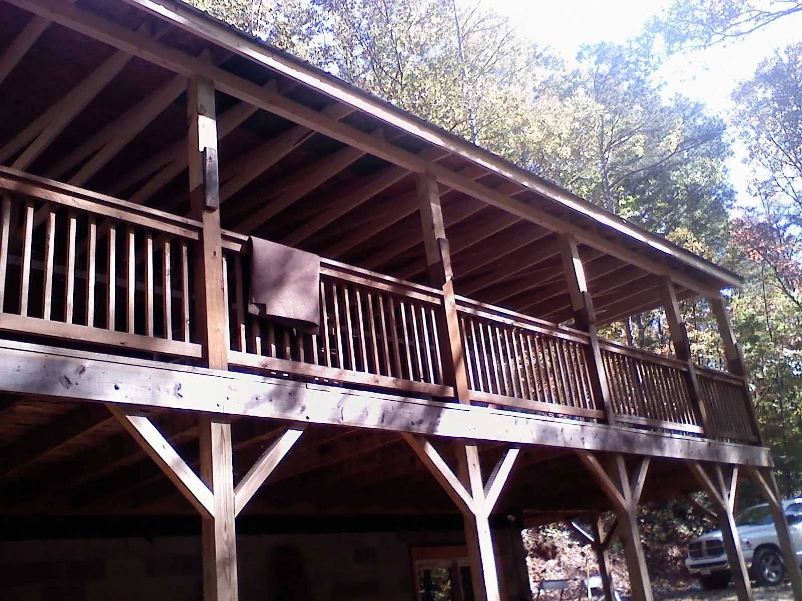 Timber framing under a new elevated porch and deck — Roof Leak Repair in Alliance by Roofing Brothers